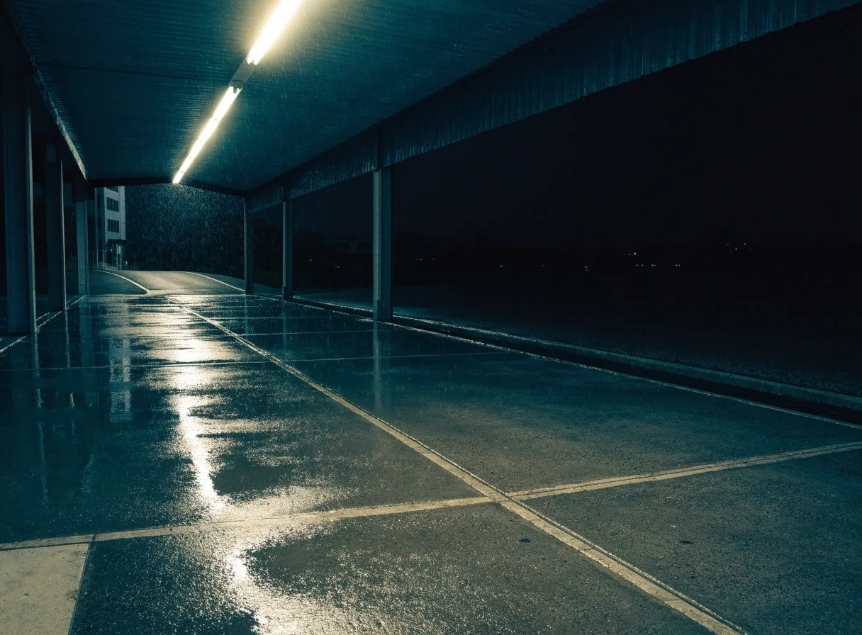Covered walkway to the car park at night