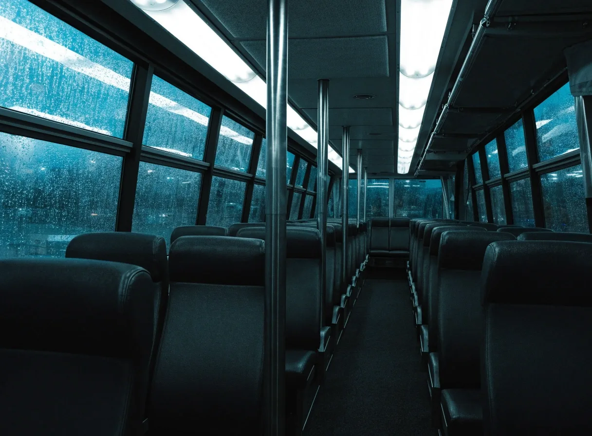 Empty shuttle bus interior at night after a flight