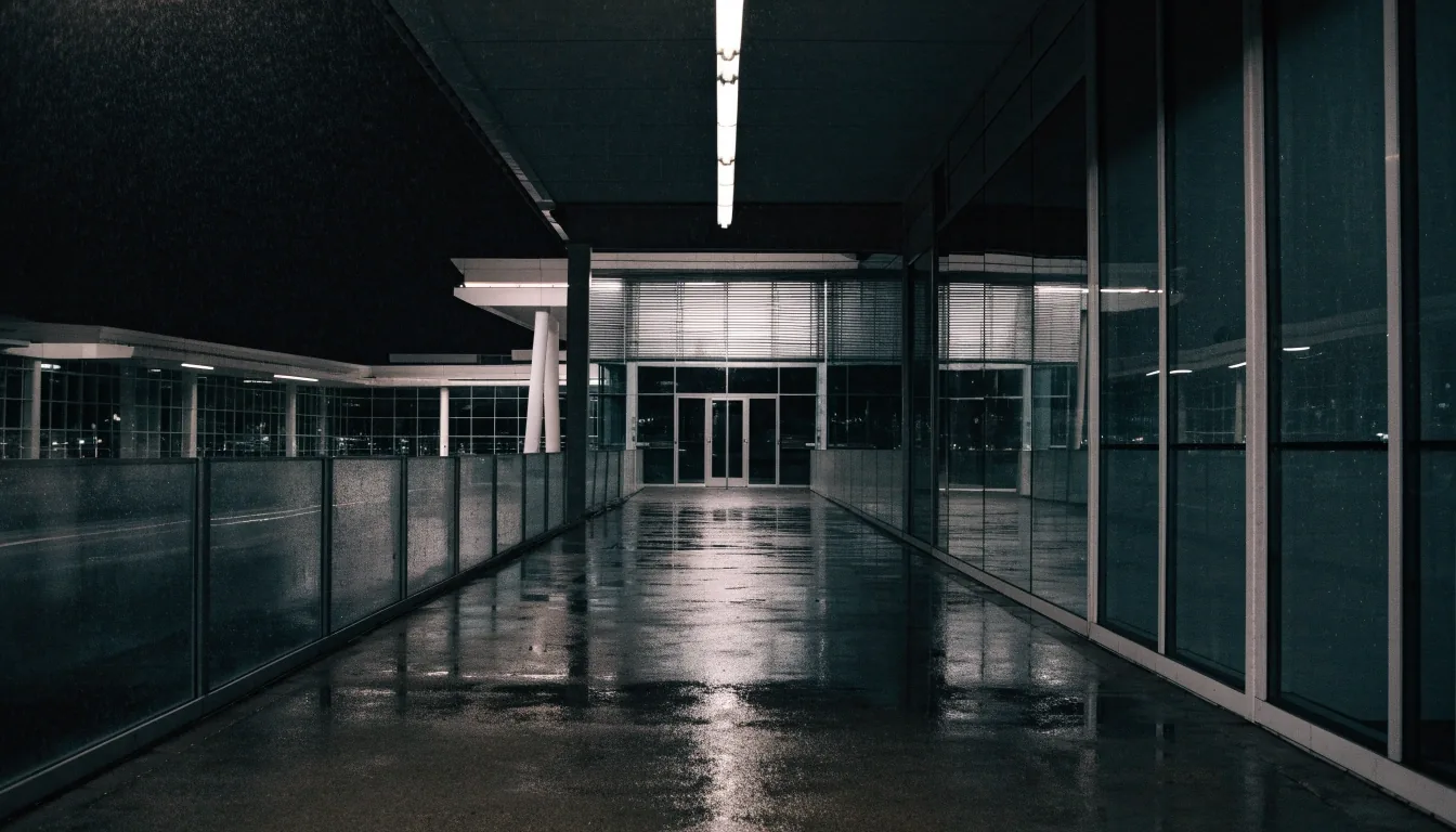 Covered walkway toward Melbourne Airport terminals at night