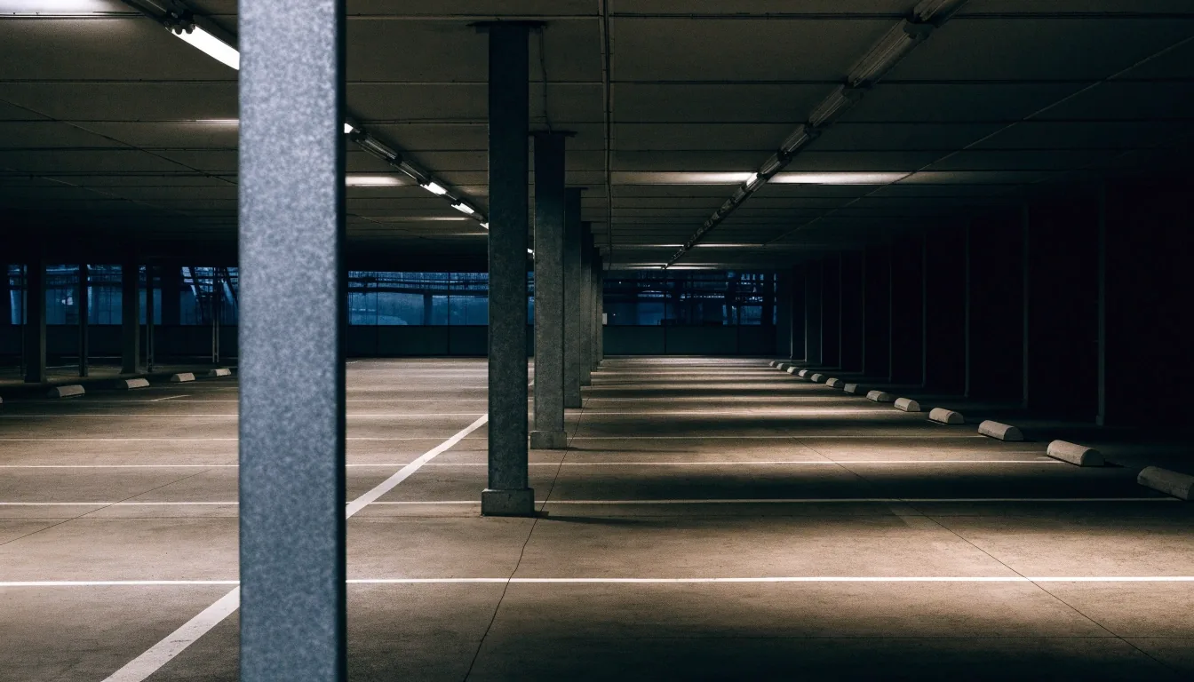 Empty undercover parking deck at Melbourne Airport at night